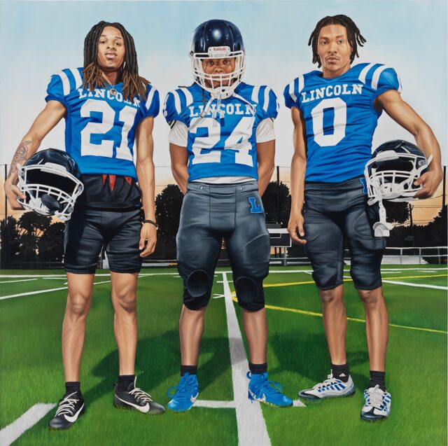 a square-format portrait in oil of three football players in blue uniforms that read "Lincoln," standing on a football field and looking directly at the viewer