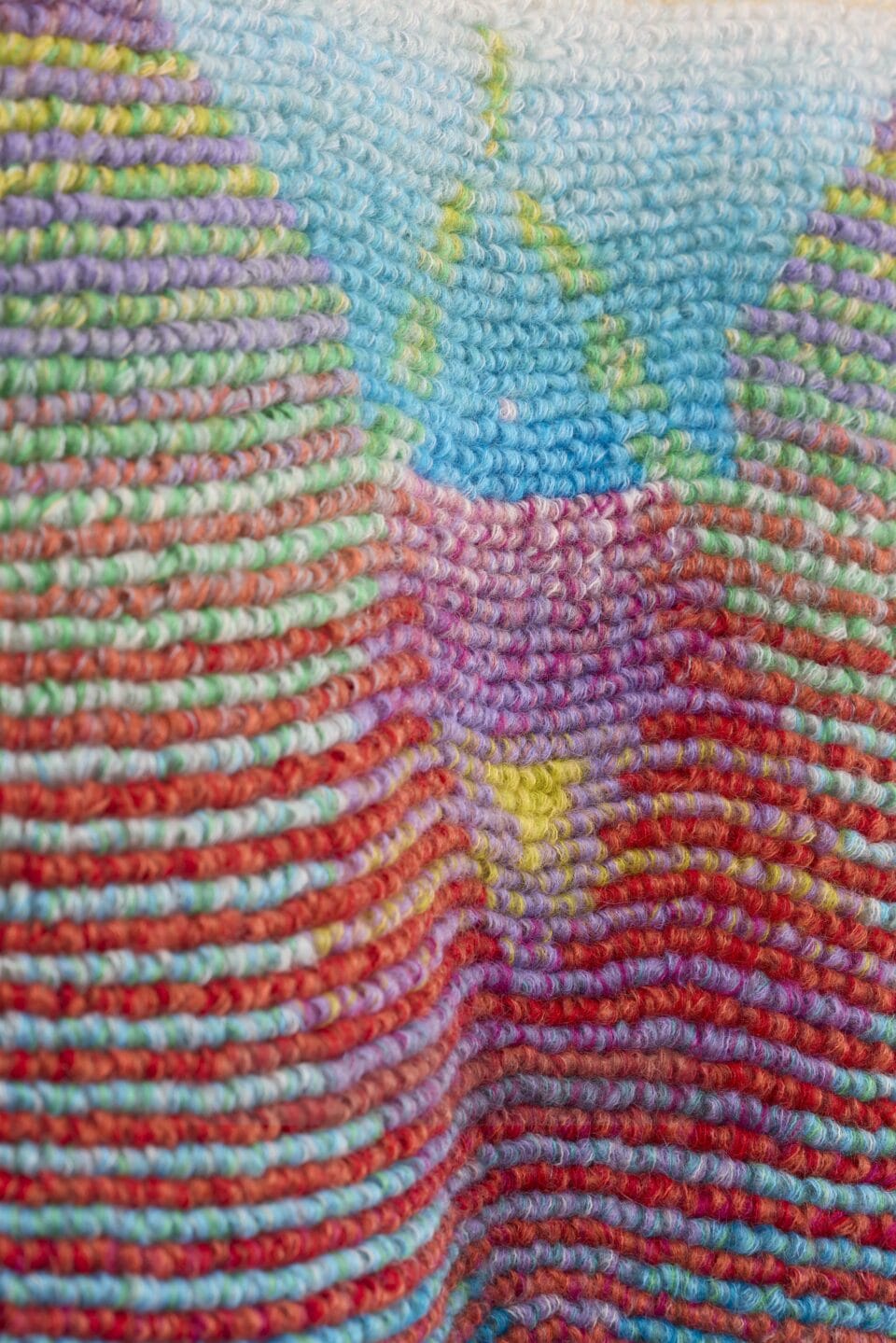 a detail of an abstract, bright weaving