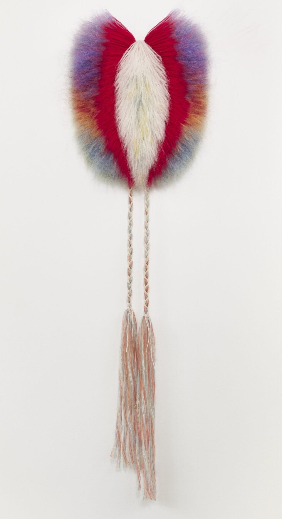 an abstract, bright weaving radiating fiber in red, white, and blue into a puffy form, with long fibers gathered and draping long at the bottom