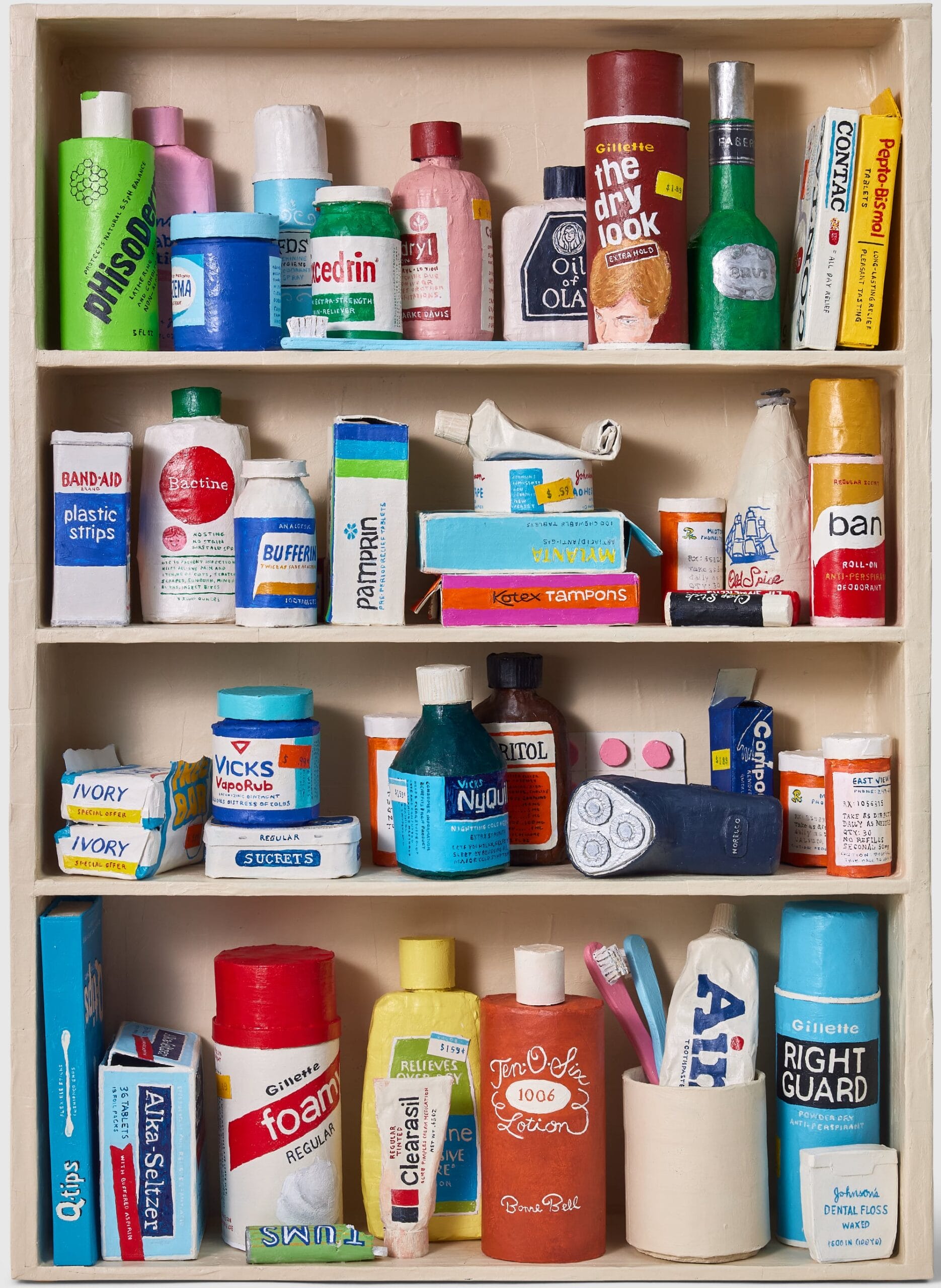 a paper mache sculpture of a medicine cabinet filled with over the counter medicines, prescriptions, and other bathroom goods