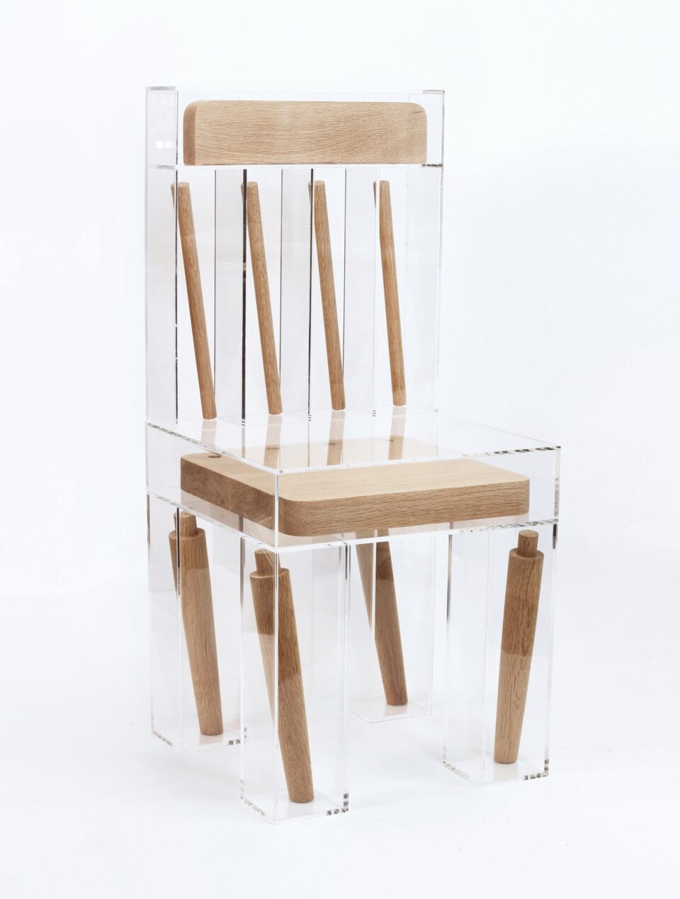 a sculptural chair in which wooden pieces like the seat, leds, and back, are individually encased in plexiglass