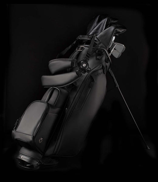 Black Player IV golf stand bag in a black studio