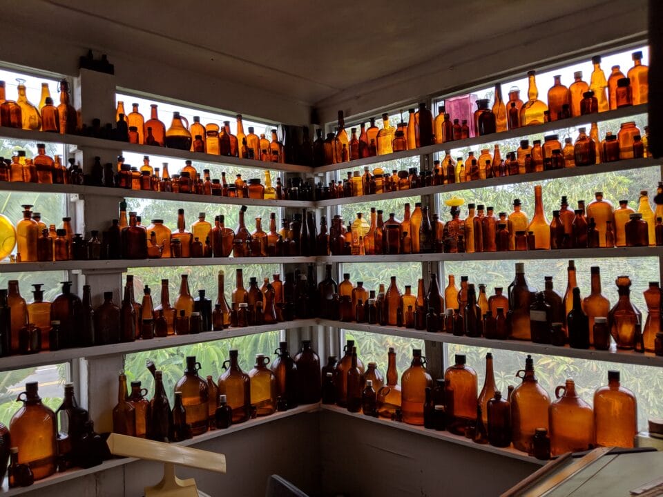 the interior of the Reuben Hale House, featuring shelves of hundreds of brown bottles