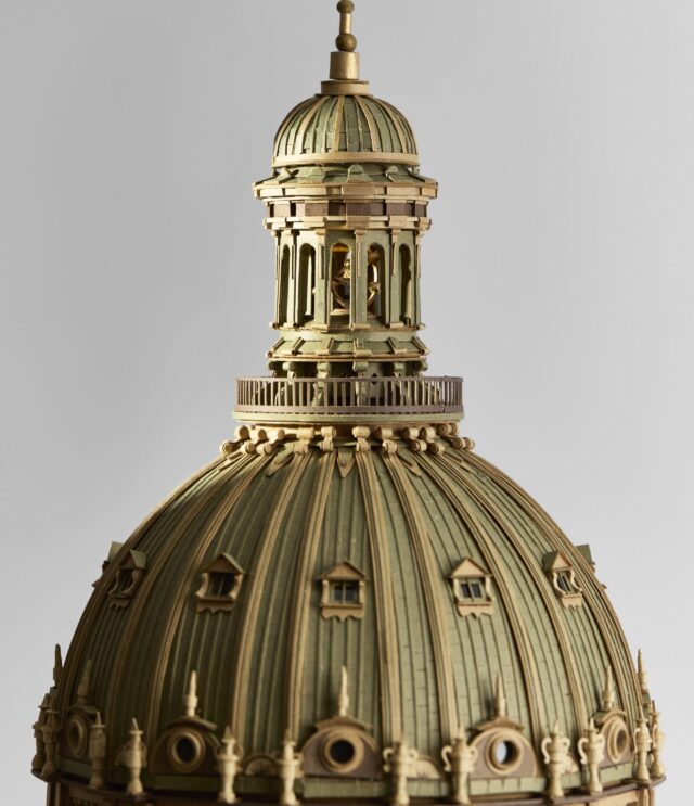 a detail of an intricate cardboard sculpture of an elaborate cathedral dome