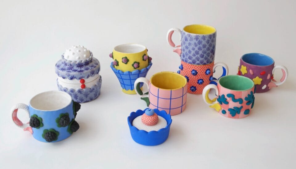 a selection of confectionery- and flower-inspired mugs in a variety of bright colors and patterns