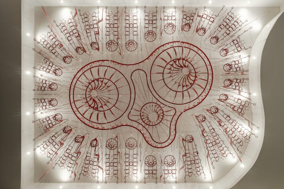 a large-scale ceiling installation of intricate metalwork