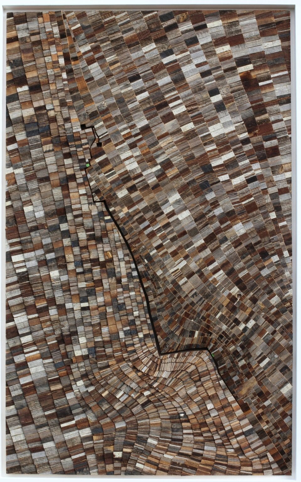 detail of an abstract artwork in a long, horizontal format, made from tiny, dark wooden shingles